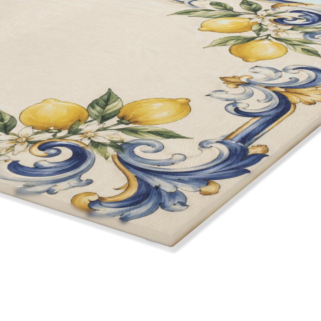 Closeup of soft blue and gold scrollwork with lemon blossoms permanently fired on glass serving board