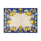 Italian blue and yellow glass charcuterie board styled on kitchen counter with wine and fresh lemons